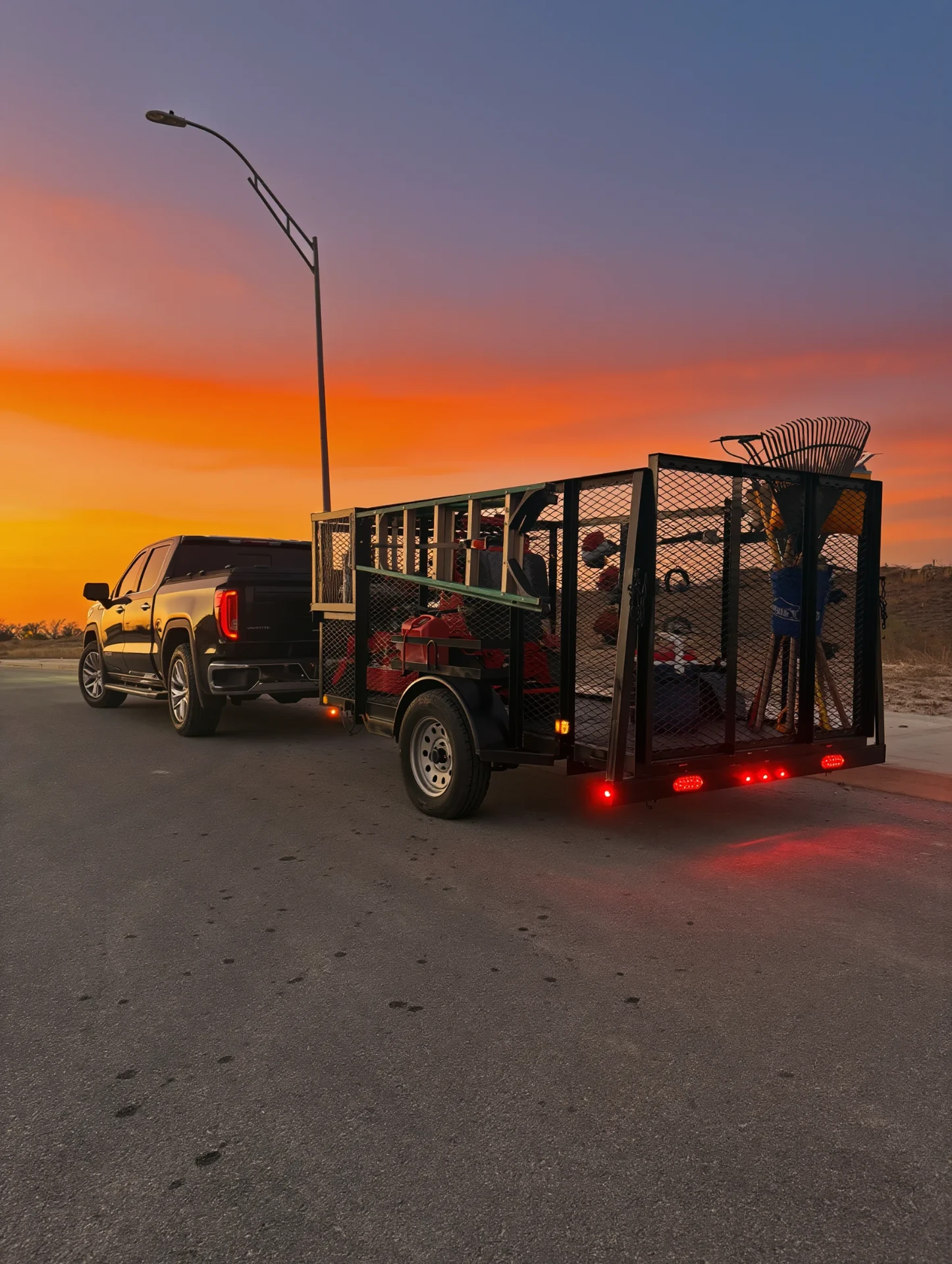 Mission Grounds work truck and trailer at sunset, San Antonio